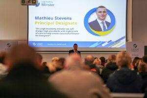 Mathieu Stevens, the principal, talking to people in a large hall