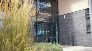 Photo of the front doors to Reception of the Snowfields Academy building.